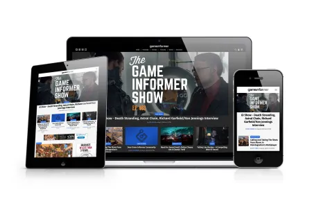 A group of electronic devices displaying the Game Informer website.